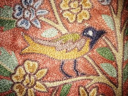 Decorative pillow with birds handmade from silk yarn