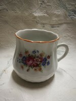 Zsolnay porcelain pot-bellied mug, with orange luster rim, flower bouquet pattern.