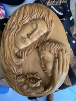 Mother and child wood carving on the wall