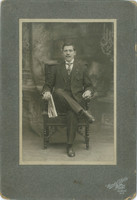 Studio photo of a wealthy, young man, full-figured. New York. A booth made in Wendel's photo studio
