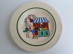 A deep earthenware plate with an old fairy tale pattern