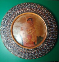 An old folk wooden plate decorated with a hand-painted portrait that can be hung on the wall