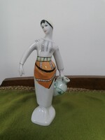 Girl carrying water in Romanian folk costume, porcelain