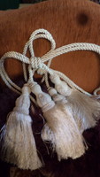 1 Pair of tasseled curtain ties, with silky, off-white threads, in good condition.