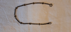 Old, bronze colored pocket watch chain