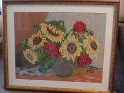 Very beautiful tapestry picture with sunflowers and poppies behind a glass panel.