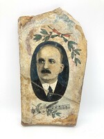 A portrait from the 1920s painted on slate and basalt rock from Gellerthill