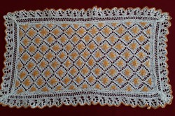 Knitted lace tablecloth with embroidered decoration