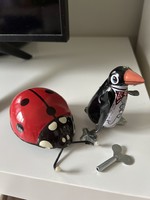 Metal pull-up ladybug and penguin