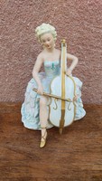 German porcelain figure, lady with cello, 23 cm