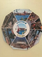 A travel souvenir, a foreign postcard available in souvenir shops. Written. Round, colorful. Stockholm Sweden