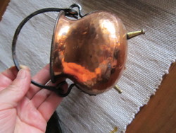 A small copper cauldron