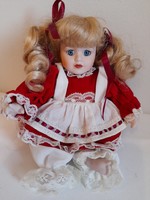 Sweet little sitting porcelain doll 22 cm