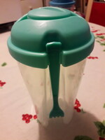 Turquoise plastic water bottle with a fork with a closable top drinking glass 20x10 cm.