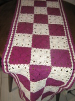 Beautiful hand-crocheted white-purple tablecloth with floral pattern