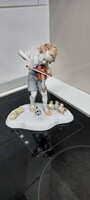 Porcelain statue of a German boy playing the violin