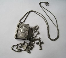St. Mary's opening book with rosary on a silver chain