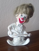 Hairy guitar-playing clown porcelain figurine, size 13 cm