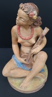 Careful ceramic Tahitian girl