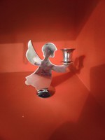 Stainless metal candle holder in the shape of an angel