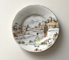 Antique painted Japanese plate with geisha dressed in kimono and landscape decoration