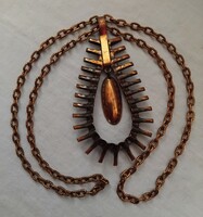 Old industrial copper pendant on patterned chain