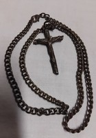 Old bronze cross crucifix pendant on a bronze chain