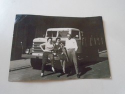 D203072 old photo of women and men posing in front of a truck - 1958