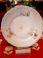 Old decorative plate with floral pattern