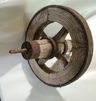 Old wooden wheelbarrow wheel