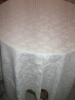 Beautiful damask tablecloth with a white flower pattern
