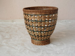 Older flower stand, basket made of natural material