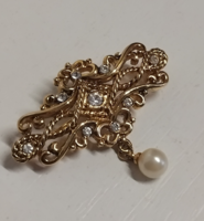 Gold-plated brooch pin with small white polished stones, decorated with tekla pearl at the bottom