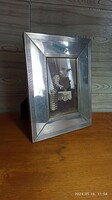 Large silver-plated picture frame with an antique photo