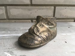 Old children's shoes made of metal