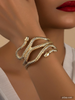 Adjustable open bracelet in the shape of a snake, can also be worn on the upper arm.