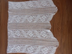 Crocheted curtain with wavy bottom
