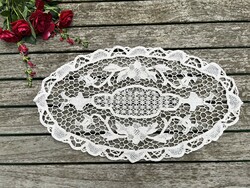 Eggshell-colored lace tablecloth with a beautiful crochet pattern