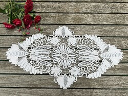 Eggshell-colored lace tablecloth with a beautiful crochet pattern