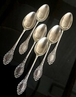 A set of silver-plated spoons richly decorated with a baroque pattern