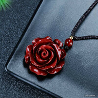 Hand carved cinnabar mineral rose pendant on chain