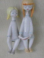 Porcelain sculpture of reading children