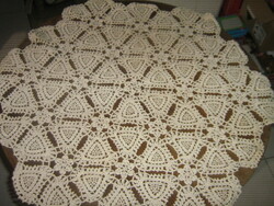 Beautiful ecru tablecloth with a hand-crocheted flower pattern