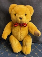 Új! Sárga színű,plüss Maci unokám Maci gyűjteményéből.Piros masnival. Drapp tappancsokkal.30 cm