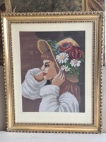 Kalapos lány- gobelin kép arany színű keretben.