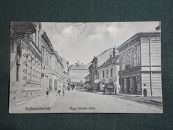 Képeslap,Székesfehérvár,Nagy Sándor utca,katona bolt,temetkezési üzlet látkép,részlet,1912-