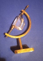 Small 10 cm high brass holder of a crystal in very good condition