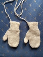 A beautiful little knitted baby glove. White color. Brand new condition.
