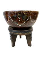 Afrikai fatál három lábú állványán