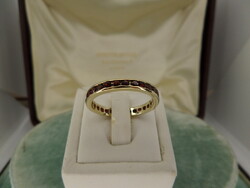 Arany eternity / körbeköves gyűrű gránátokkal